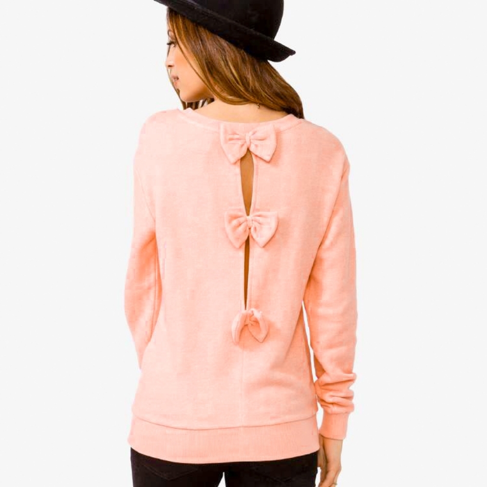 Orange vintage style sweater with Bows in the back